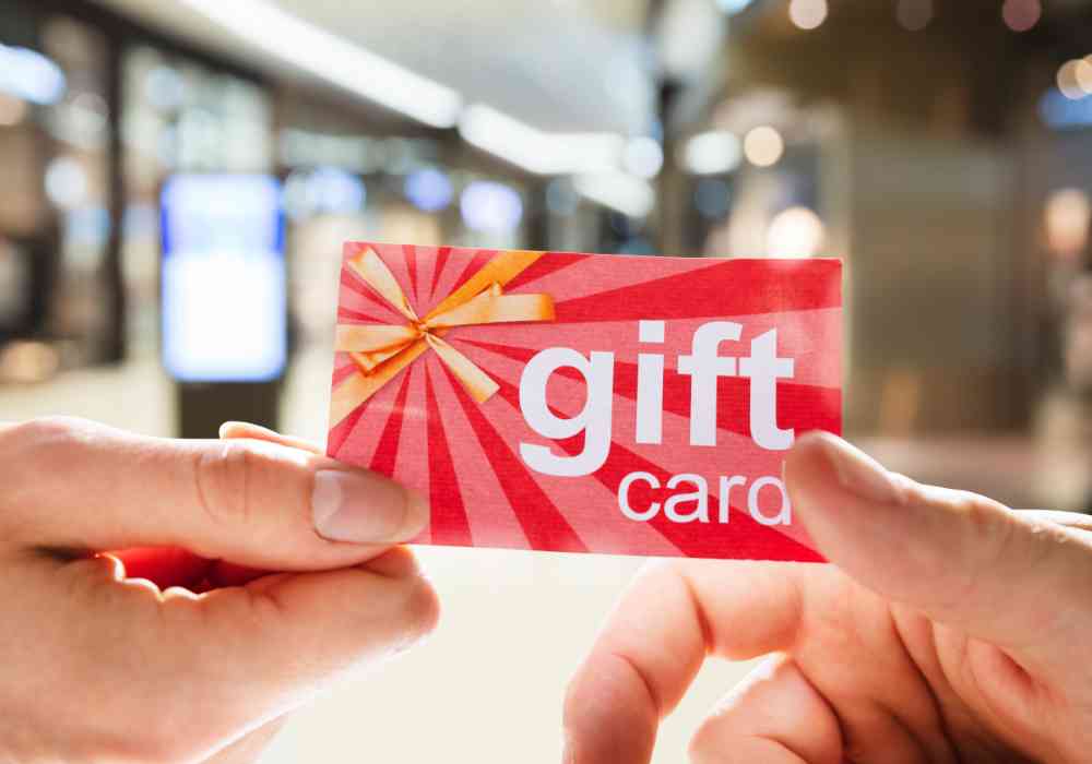 handing over a gift card